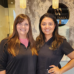 A happy patient with a Millennia Wellness staff member at a medspa in Frisco TX, following a successful aesthetic treatment.